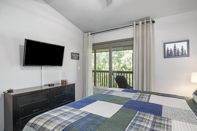 bedroom featuring vaulted ceiling, a textured ceiling, and access to outside