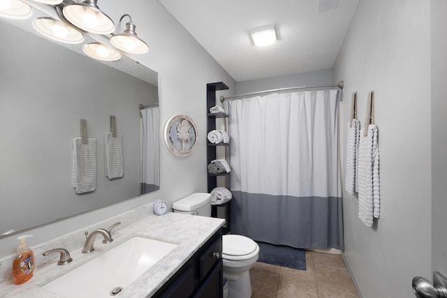 bathroom with walk in shower, tile patterned floors, toilet, a textured ceiling, and vanity