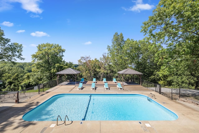 view of swimming pool featuring a gazebo and a patio