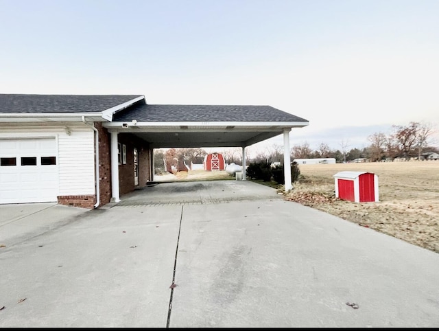 exterior space with a carport and a garage