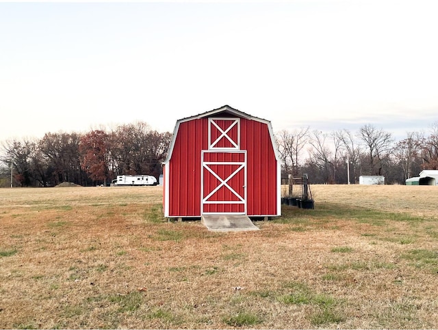 view of outdoor structure featuring a lawn