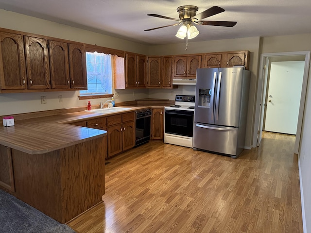 kitchen with stainless steel refrigerator with ice dispenser, sink, light wood-type flooring, black dishwasher, and electric stove