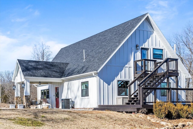 back of property featuring central AC and ceiling fan