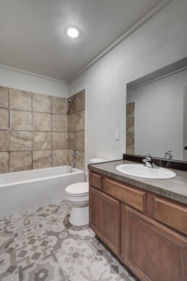 full bathroom with vanity, tiled shower / bath, and toilet