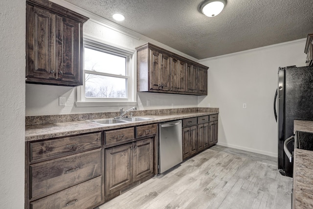 kitchen featuring sink, dark brown cabinets, ornamental molding, black fridge, and stainless steel dishwasher