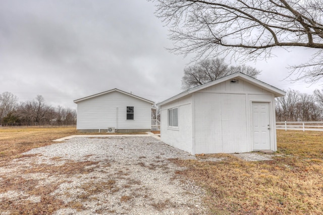 view of home's exterior featuring an outbuilding