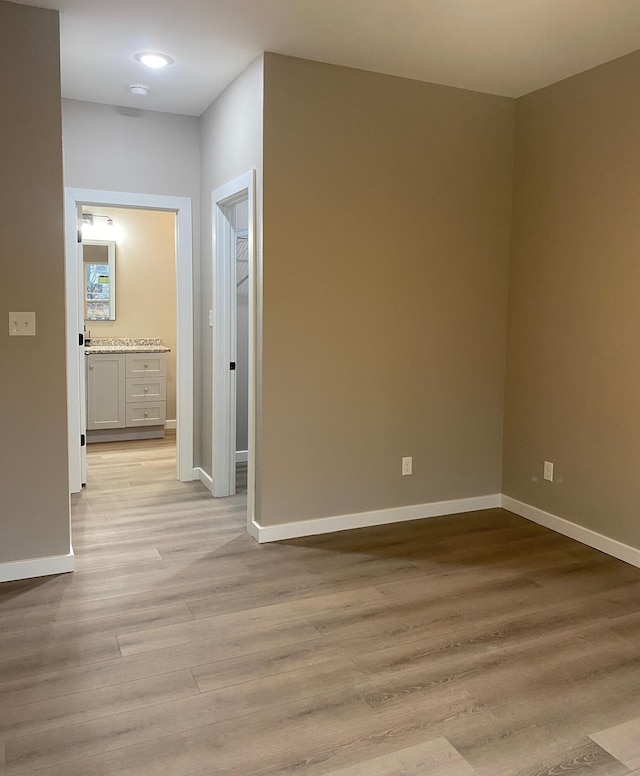 unfurnished room featuring light hardwood / wood-style floors