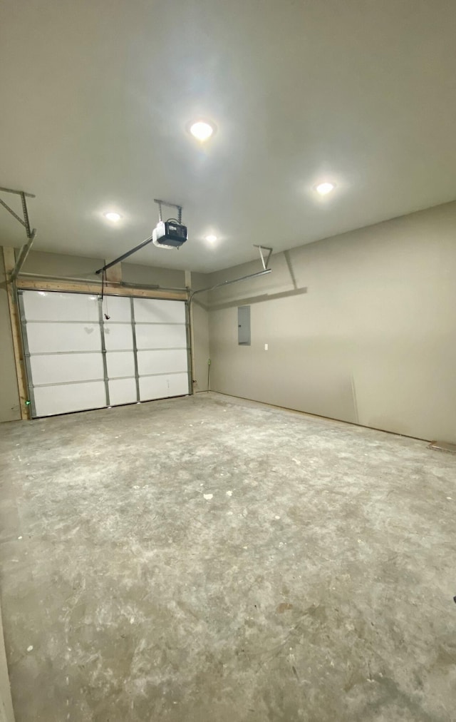 garage featuring a garage door opener and electric panel