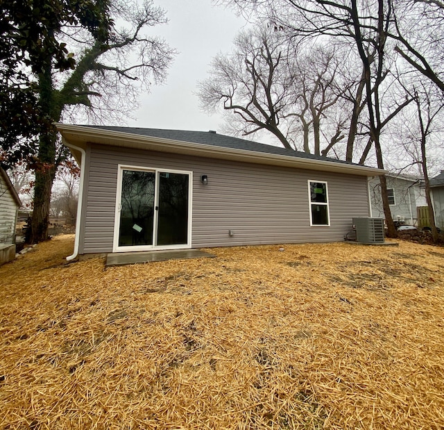 back of property with central AC