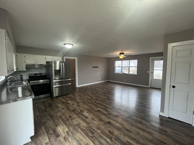 kitchen featuring sink, stainless steel appliances, dark hardwood / wood-style floors, and white cabinets