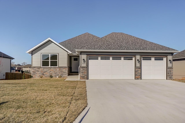 view of front of property with a garage and a front yard