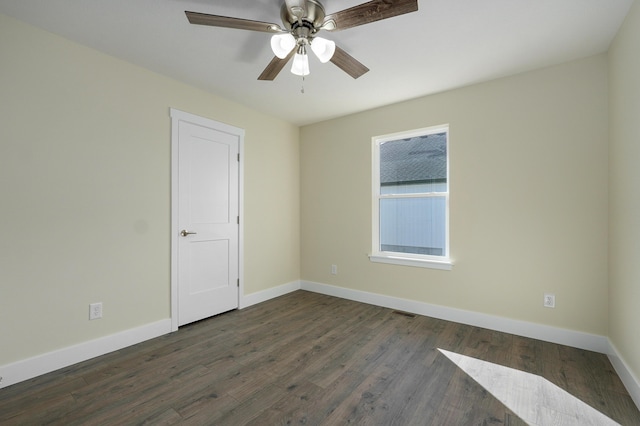 unfurnished room with dark hardwood / wood-style floors and ceiling fan