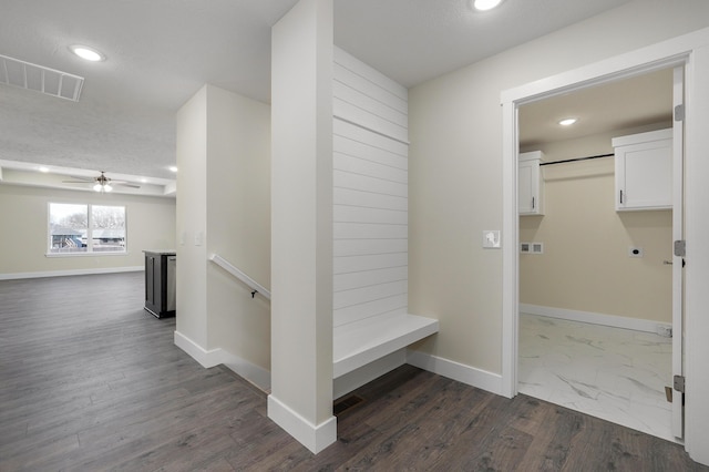 hallway with dark hardwood / wood-style floors