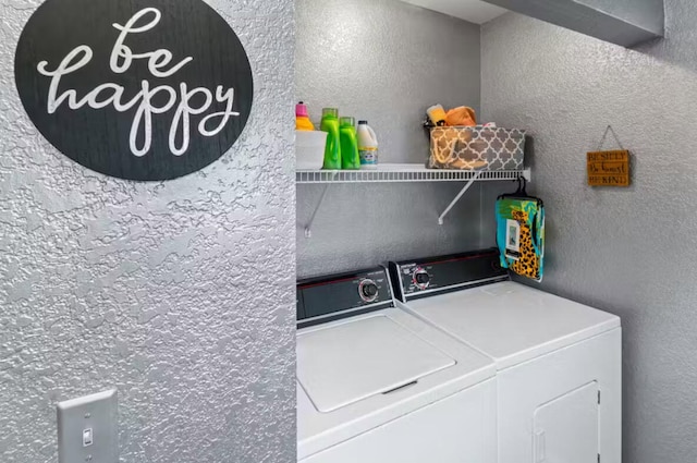 laundry room with washing machine and dryer