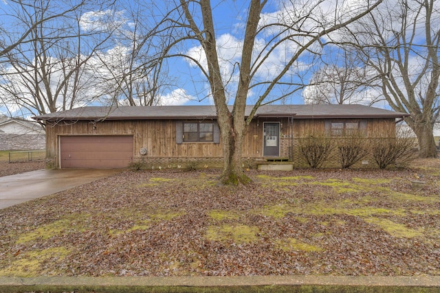 single story home with a garage