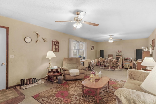 carpeted living room with a textured ceiling and ceiling fan