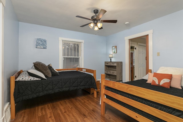 bedroom with hardwood / wood-style flooring and ceiling fan