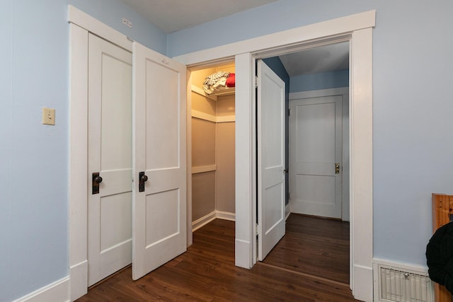 hall featuring dark wood-type flooring