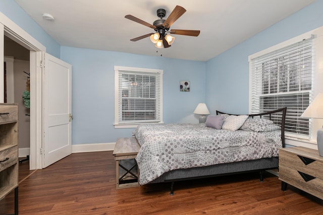 bedroom featuring ceiling fan and dark hardwood / wood-style flooring