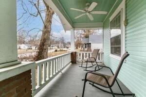 balcony featuring ceiling fan and a porch