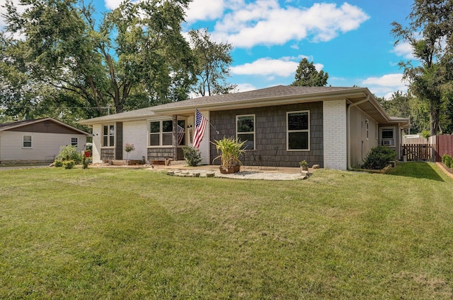 single story home with a front yard