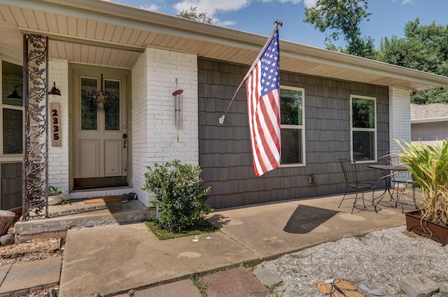 doorway to property with a patio