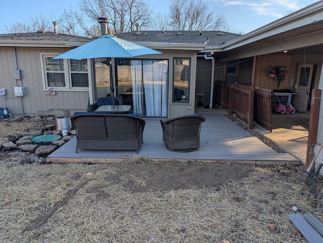 view of patio with an outdoor living space and a deck