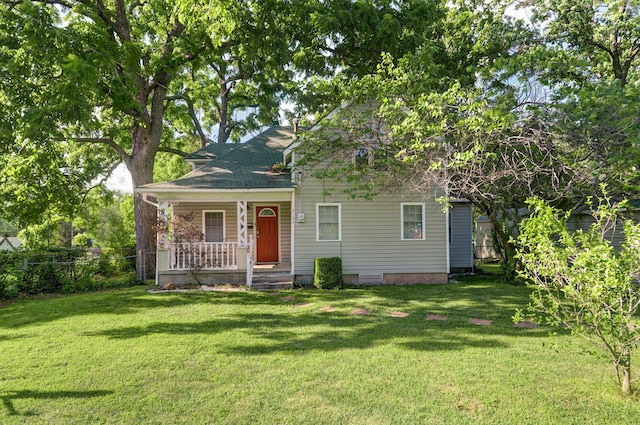 view of front of home with a front yard and covered porch