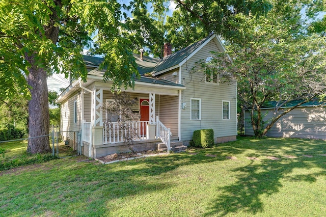 bungalow-style house featuring a front yard