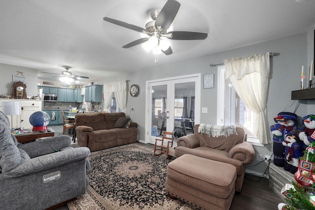 living room with french doors, ceiling fan, and hardwood / wood-style floors