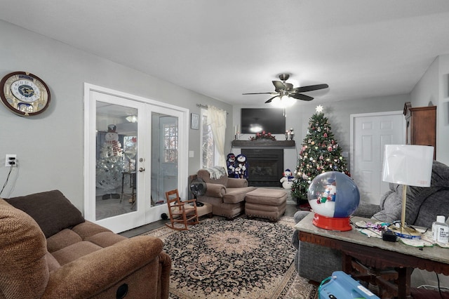 living room featuring french doors and ceiling fan