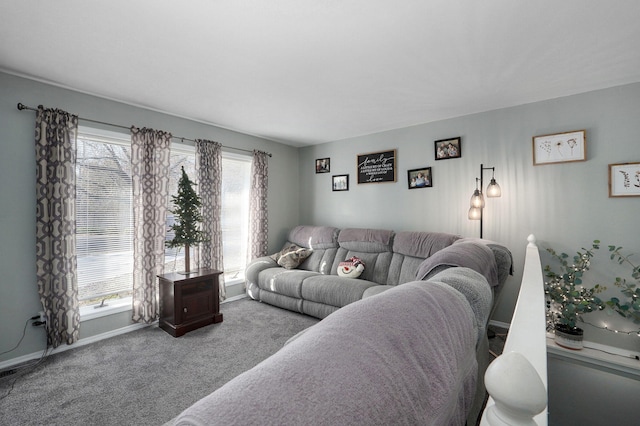 living room featuring a healthy amount of sunlight and carpet floors