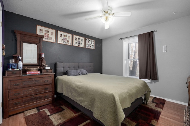 bedroom featuring dark hardwood / wood-style floors and ceiling fan