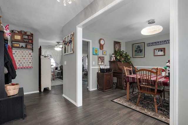 dining room featuring dark wood-type flooring and ceiling fan