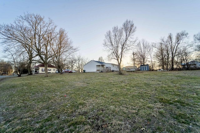 view of yard at dusk