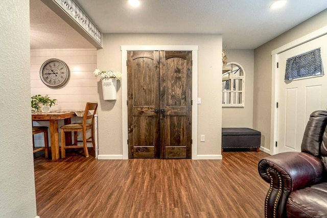 entrance foyer with dark hardwood / wood-style floors