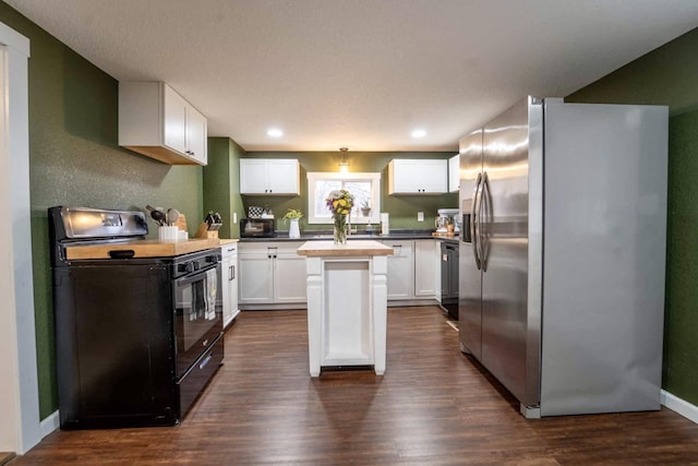 kitchen featuring dark wood-type flooring, white cabinets, a kitchen island, stainless steel fridge with ice dispenser, and black range