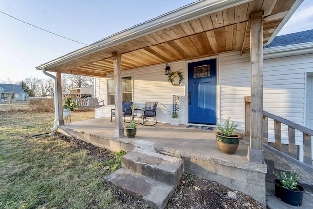 doorway to property with covered porch