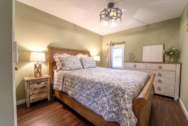 bedroom featuring dark hardwood / wood-style floors