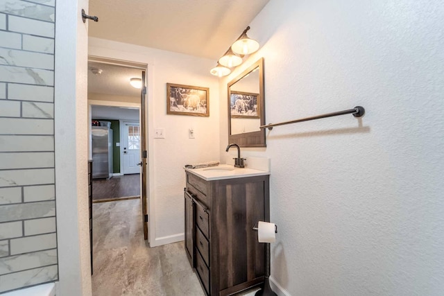 bathroom featuring hardwood / wood-style flooring and vanity