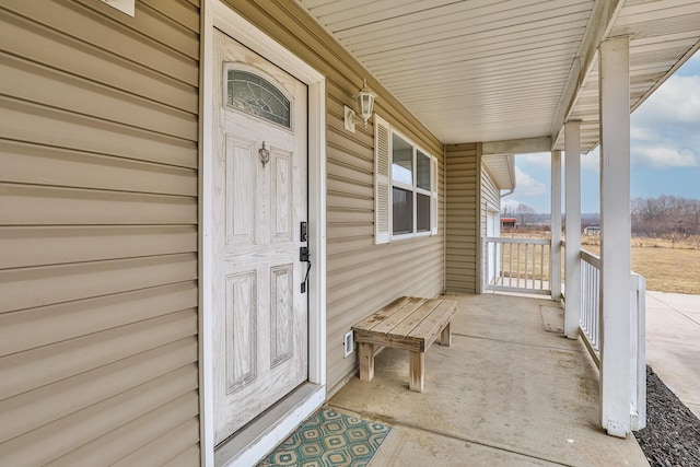 doorway to property with covered porch