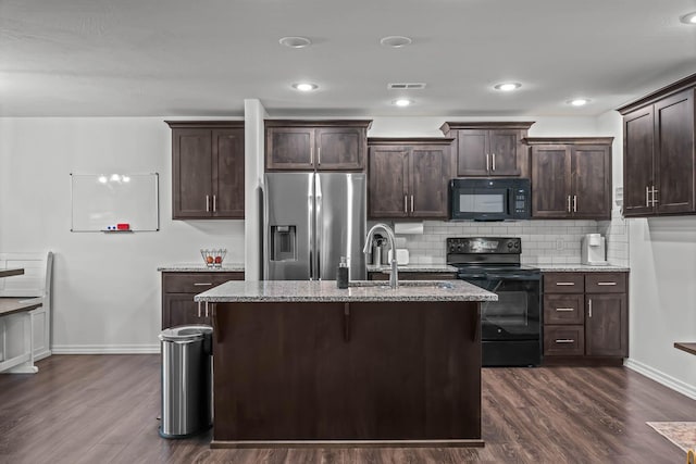 kitchen featuring dark brown cabinets, sink, dark hardwood / wood-style floors, and black appliances