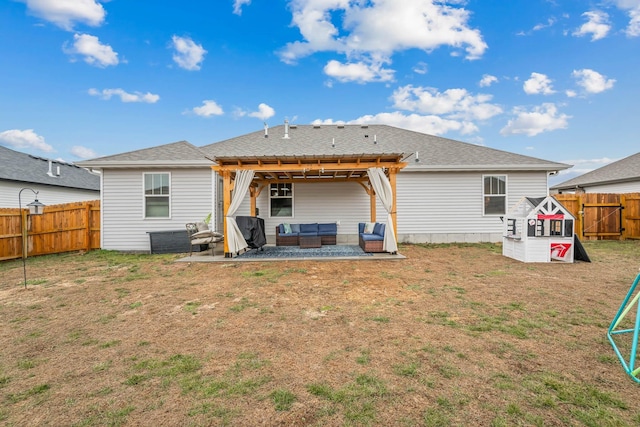 back of house with a yard, an outdoor hangout area, and a patio area