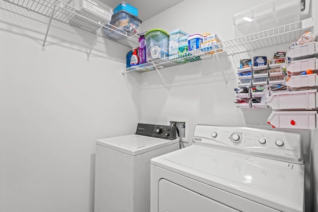 laundry room featuring washer and clothes dryer