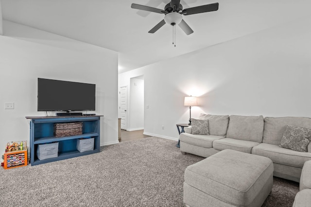 carpeted living room featuring ceiling fan