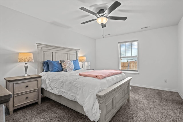 bedroom with ceiling fan and dark colored carpet