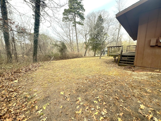 view of yard featuring a wooden deck