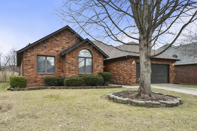 view of front of house featuring a garage and a front lawn