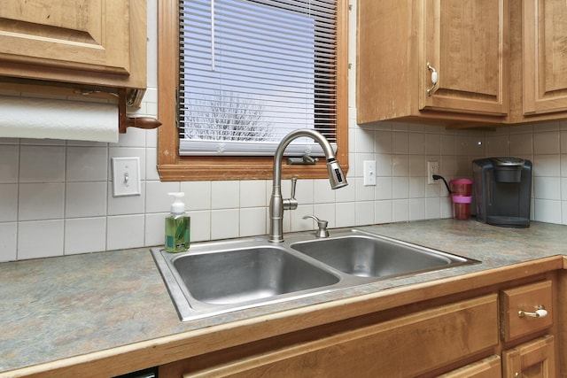 kitchen featuring sink and decorative backsplash