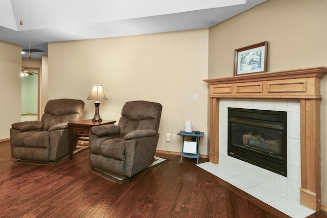 interior space with dark hardwood / wood-style flooring and a tile fireplace